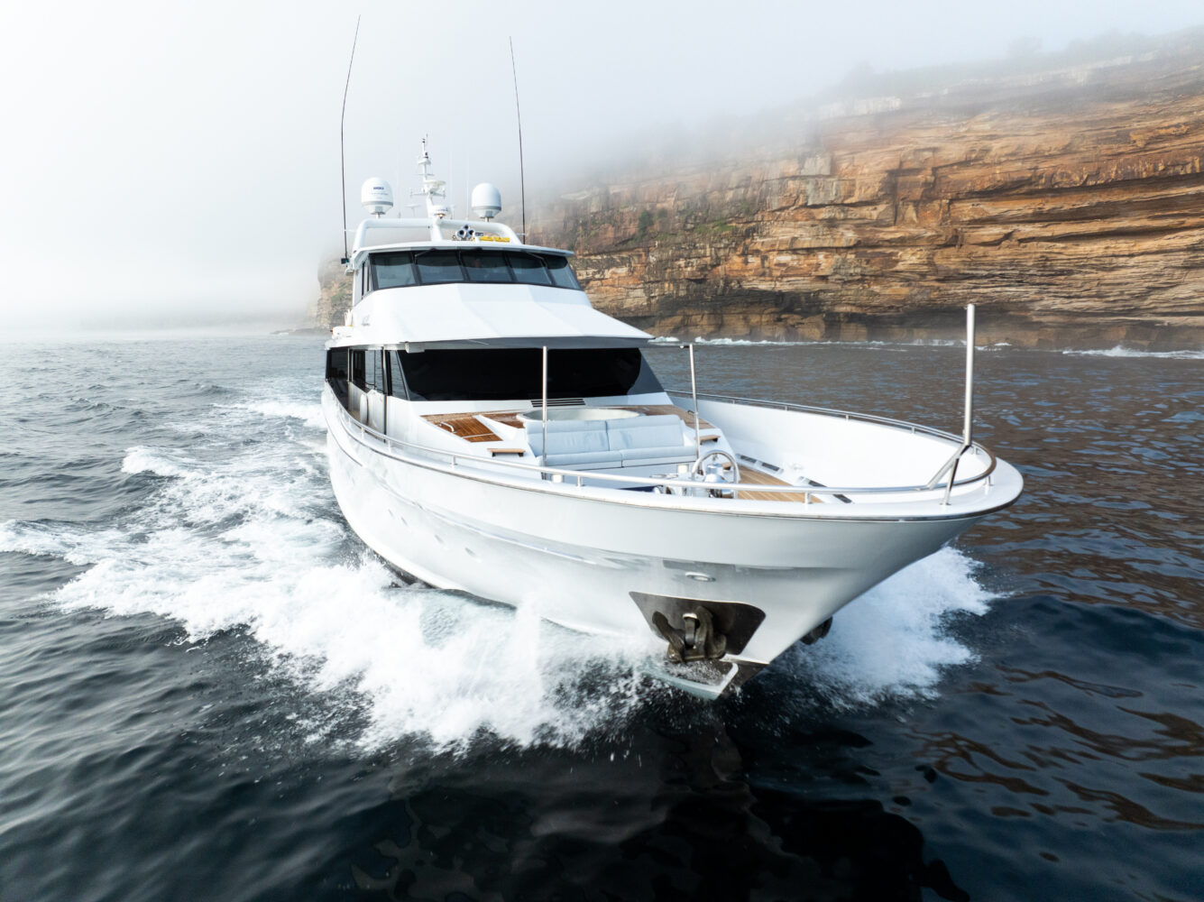 default yacht starboard side with cliff background